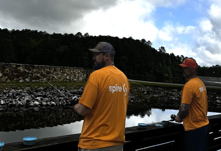 Image of Spire employees fishing at volunteer event