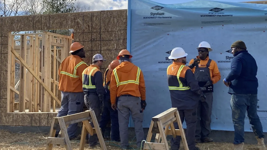Image of volunteers building a habitat for humanity home