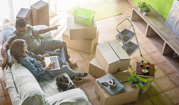 Moving boxes on floor of new home