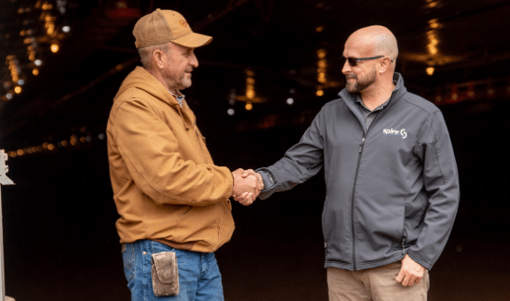 Spire employee shaking customer hand