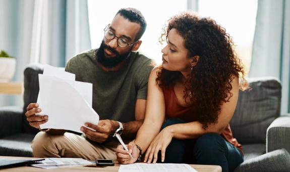 Image of: Family looking at bills