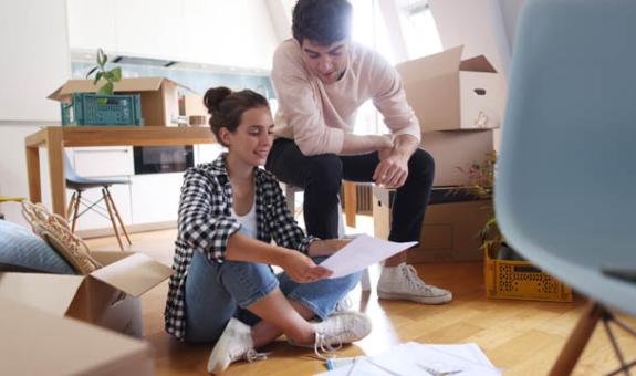 Image of couple moving in to new home