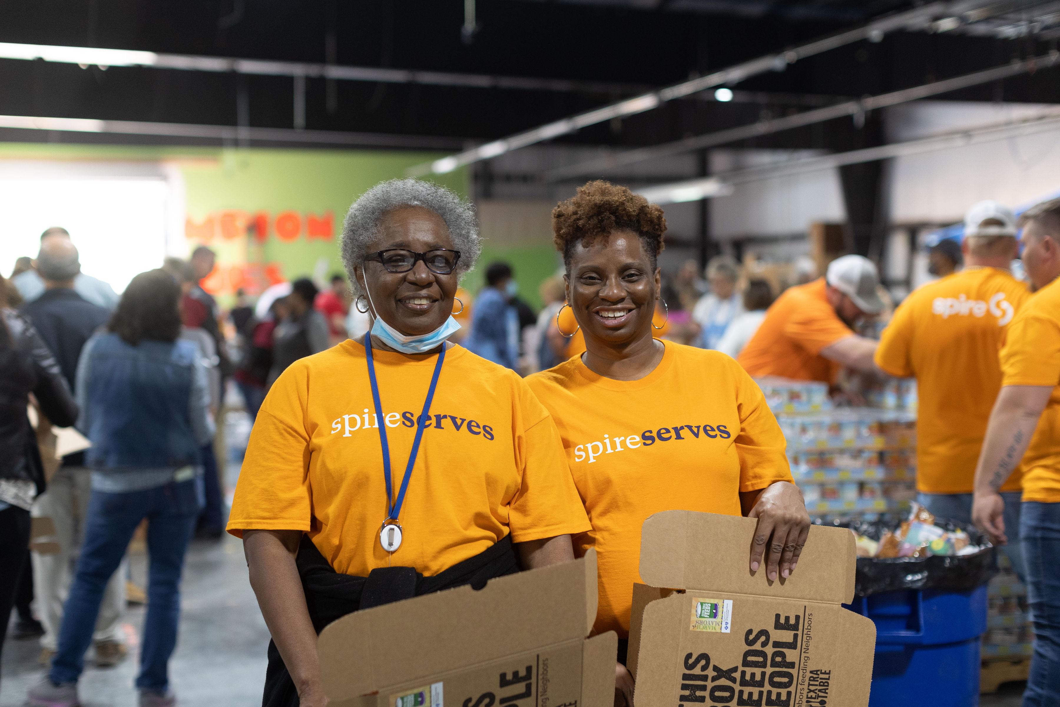 Image of: Spire employees volunteering at local food bank