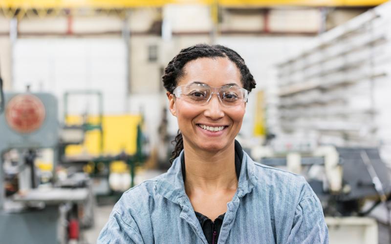 Image of employee wearing safety glasses in manufacturing facility