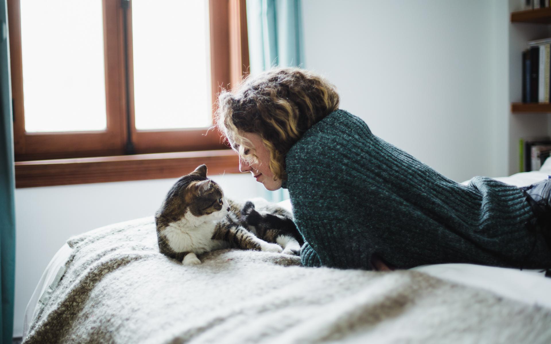 Image of woman snuggling with her cat